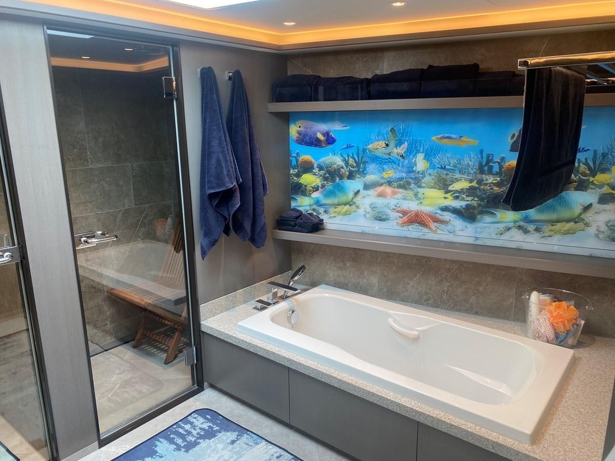 a bathroom with a large fish tank aboard NO DESTINATION Yacht for Sale