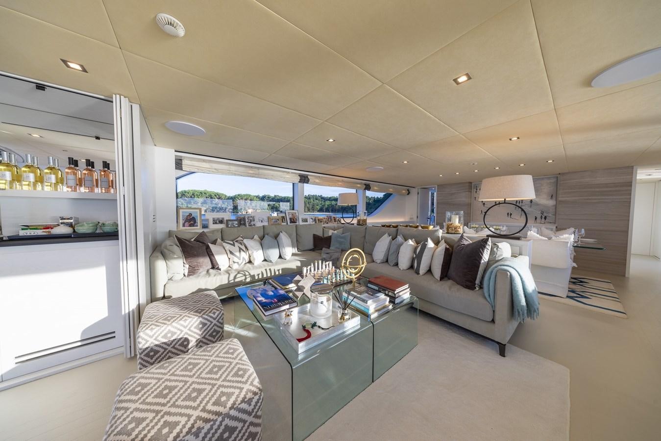 a living room with a large window aboard ZULU 3 Yacht for Sale