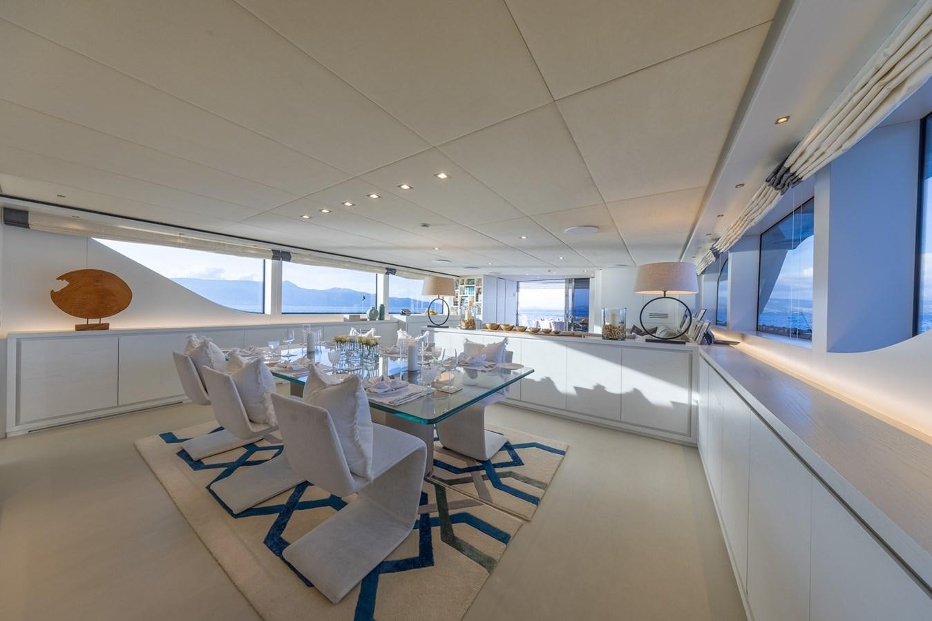a room with a table and chairs aboard ZULU 3 Yacht for Sale