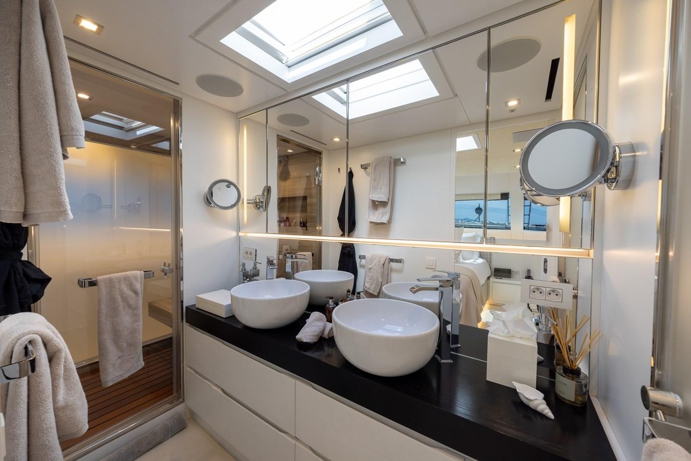 a bathroom with sinks and mirrors aboard ZULU 3 Yacht for Sale