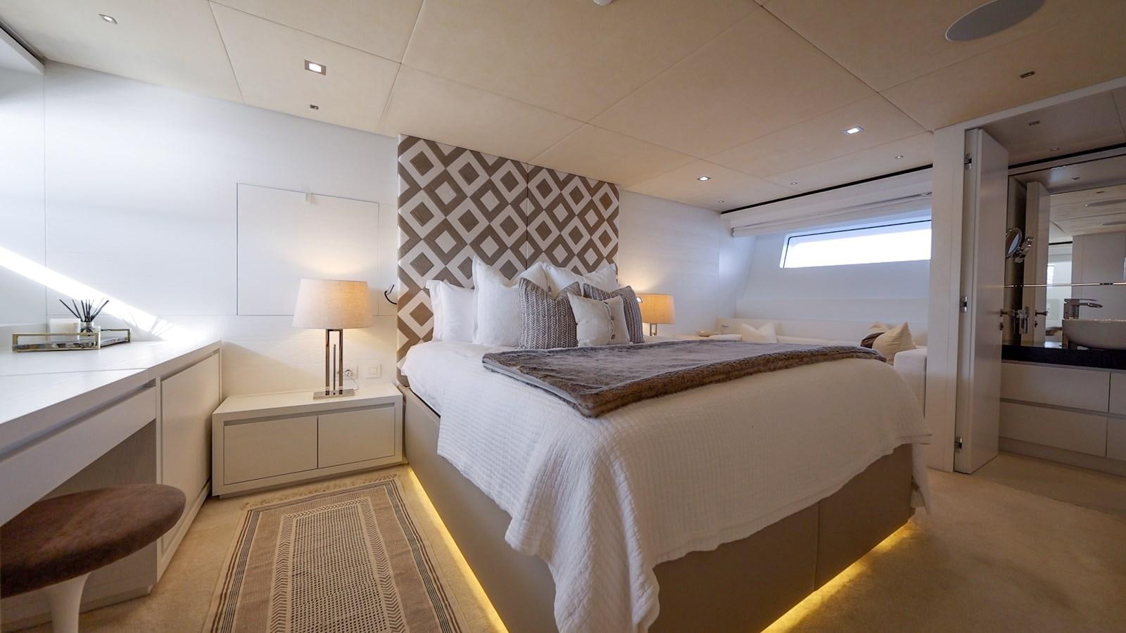 a room with a bed and a desk aboard ZULU 3 Yacht for Sale