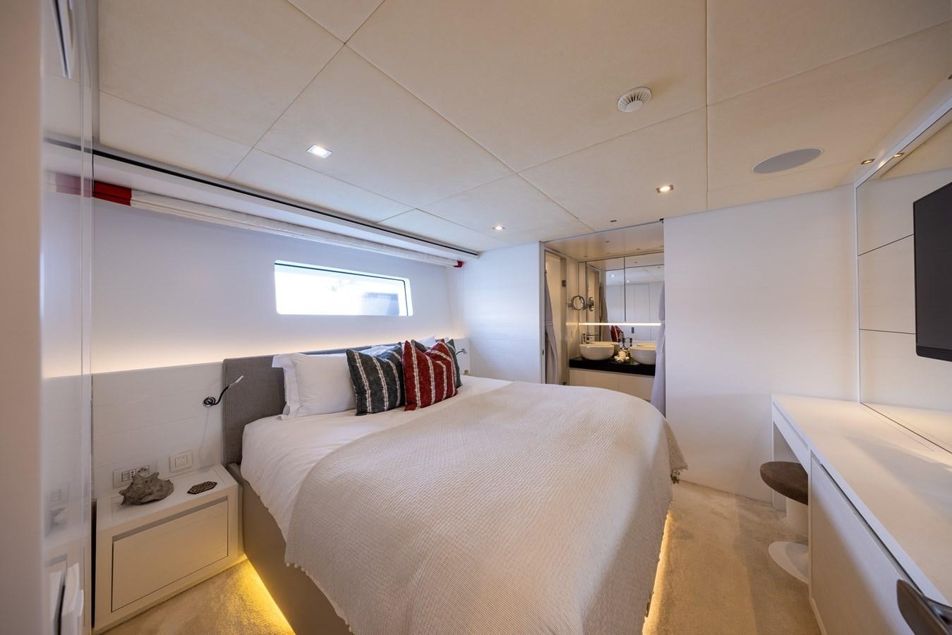 a bedroom with a bed aboard ZULU 3 Yacht for Sale