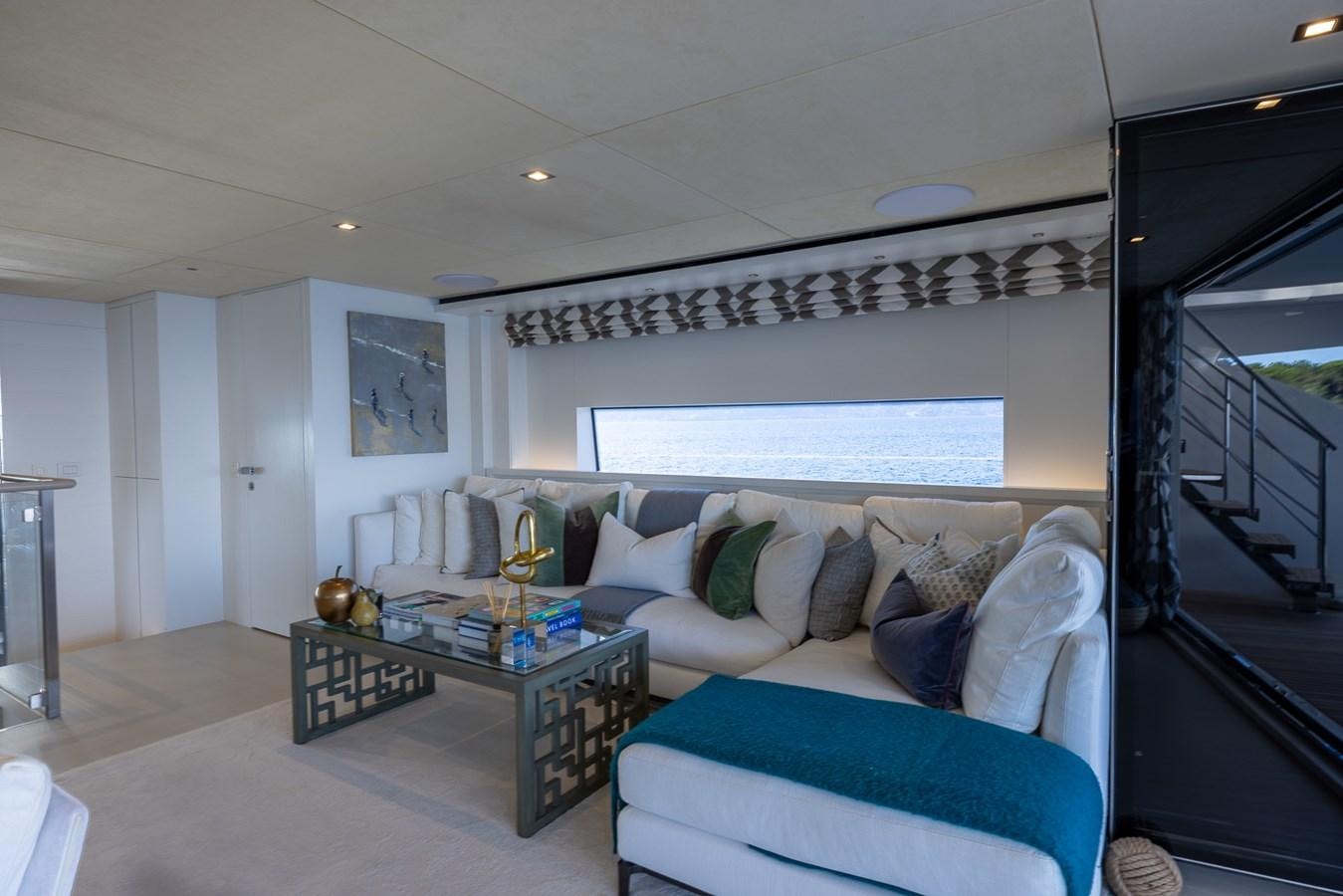 a living room with a couch and a table aboard ZULU 3 Yacht for Sale