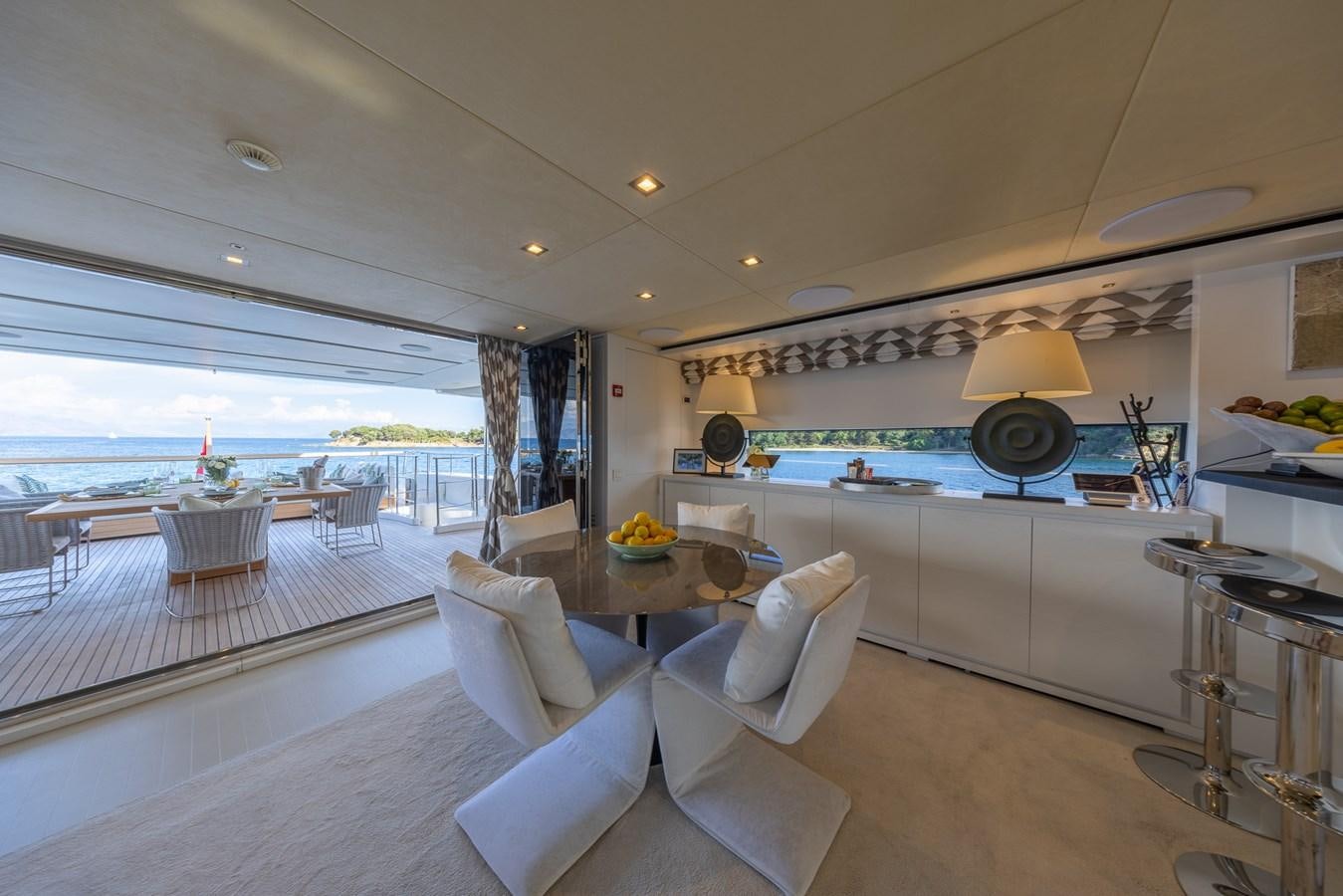 a large living room with a large balcony aboard ZULU 3 Yacht for Sale