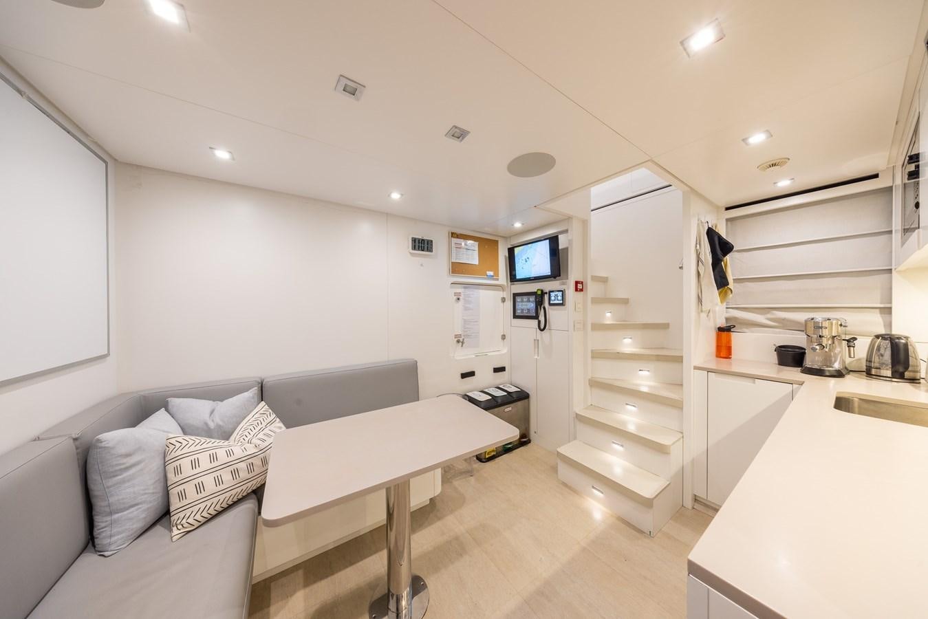 a room with a bed and a desk aboard ZULU 3 Yacht for Sale