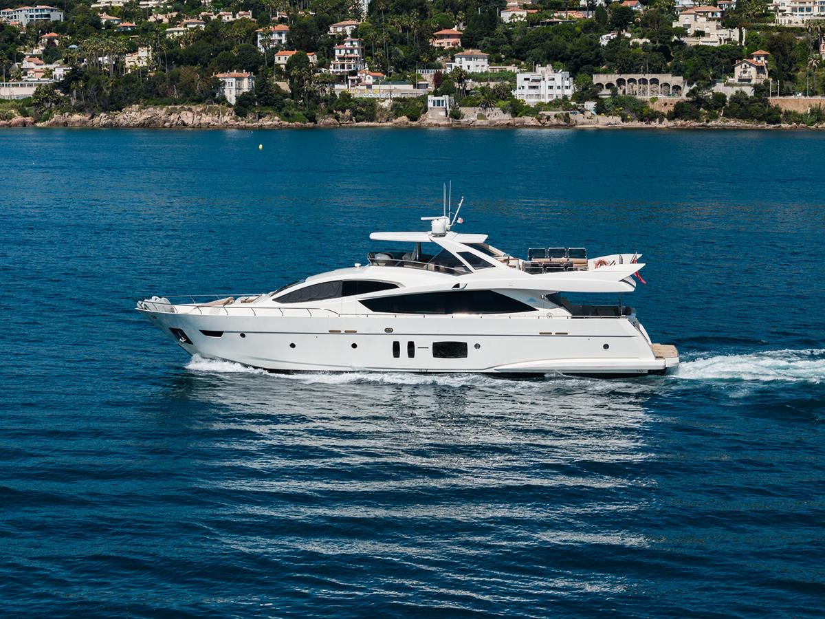 a white yacht on the water aboard GRACE Yacht for Sale