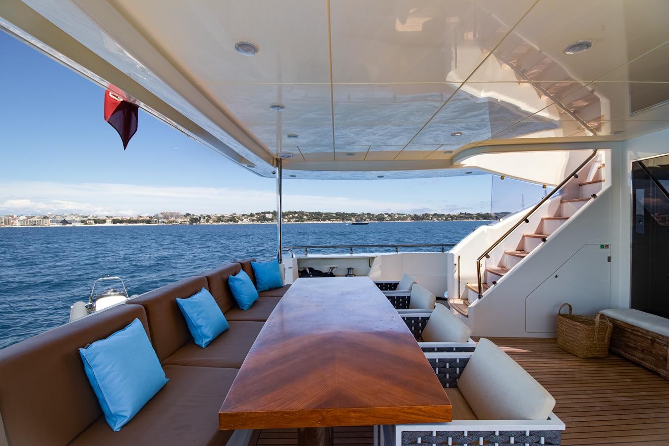 a room with a view of the water and a beach aboard GRACE Yacht for Sale