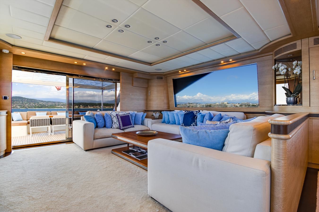 a living room with a large window aboard GRACE Yacht for Sale