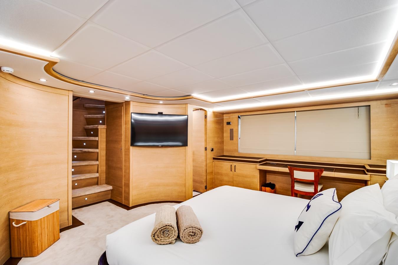a room with a bed and a staircase aboard GRACE Yacht for Sale