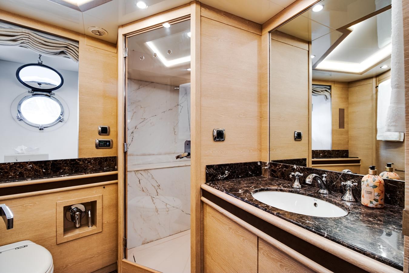 a bathroom with a sink and a mirror aboard GRACE Yacht for Sale