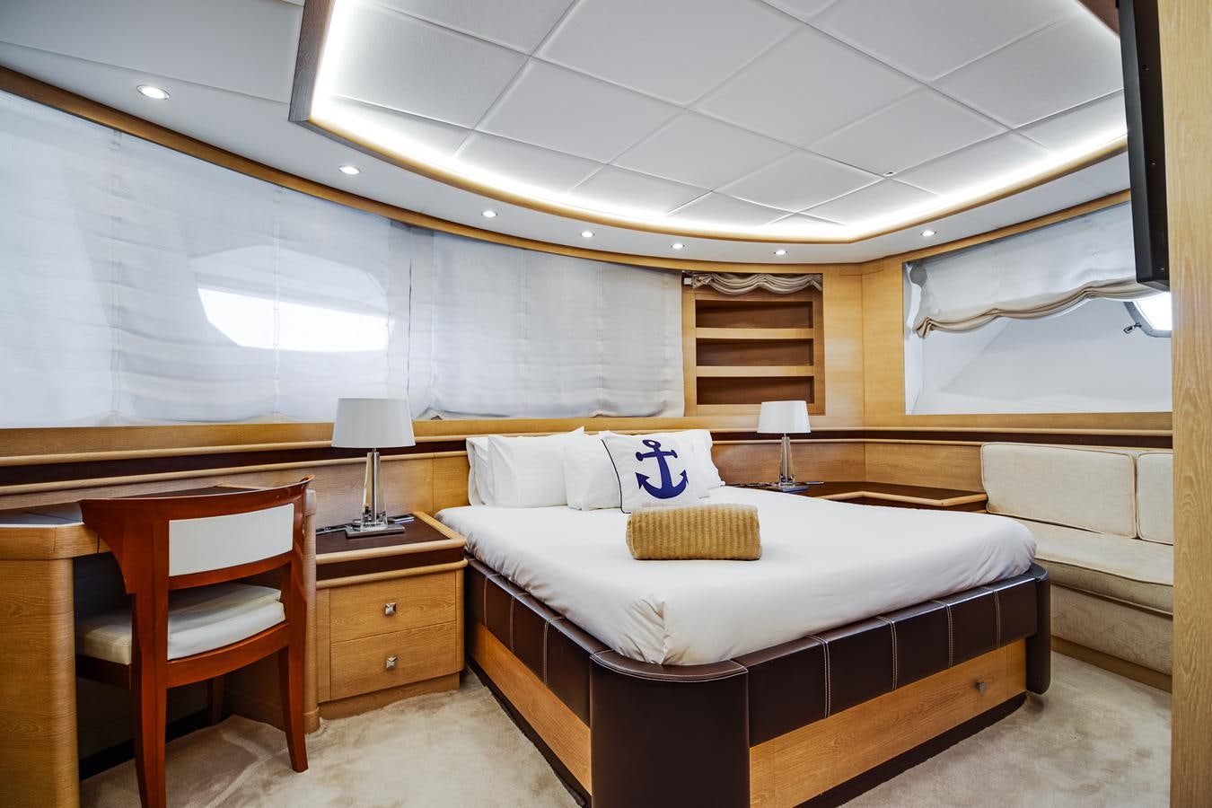 a room with a bed and a desk aboard GRACE Yacht for Sale
