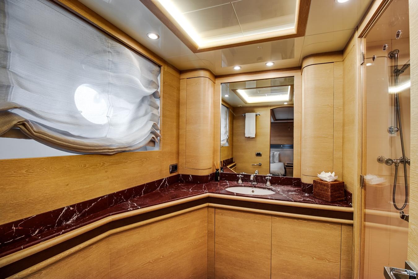 a bathroom with a large mirror aboard GRACE Yacht for Sale