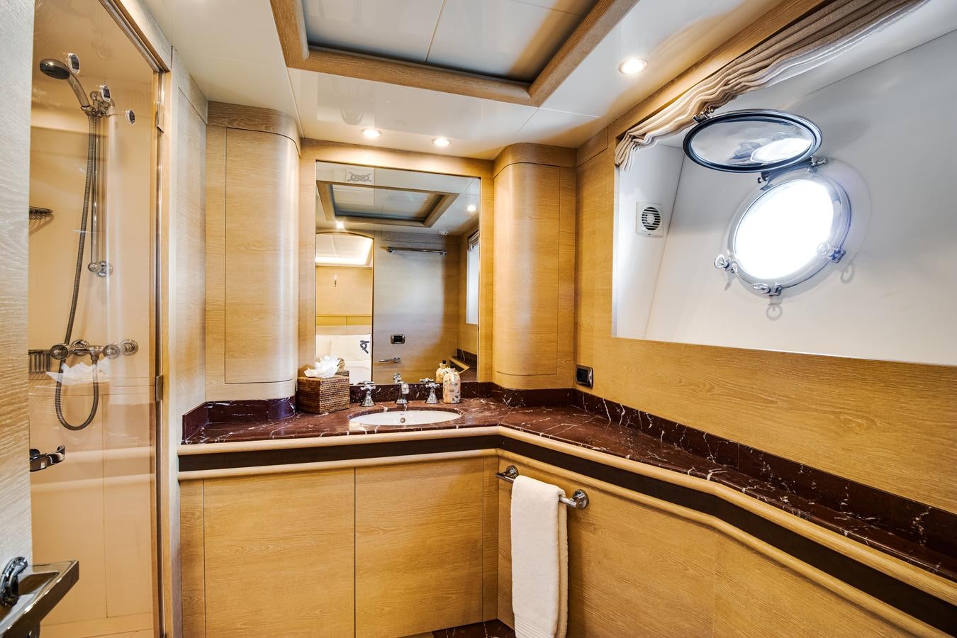 a bathroom with a large mirror aboard GRACE Yacht for Sale
