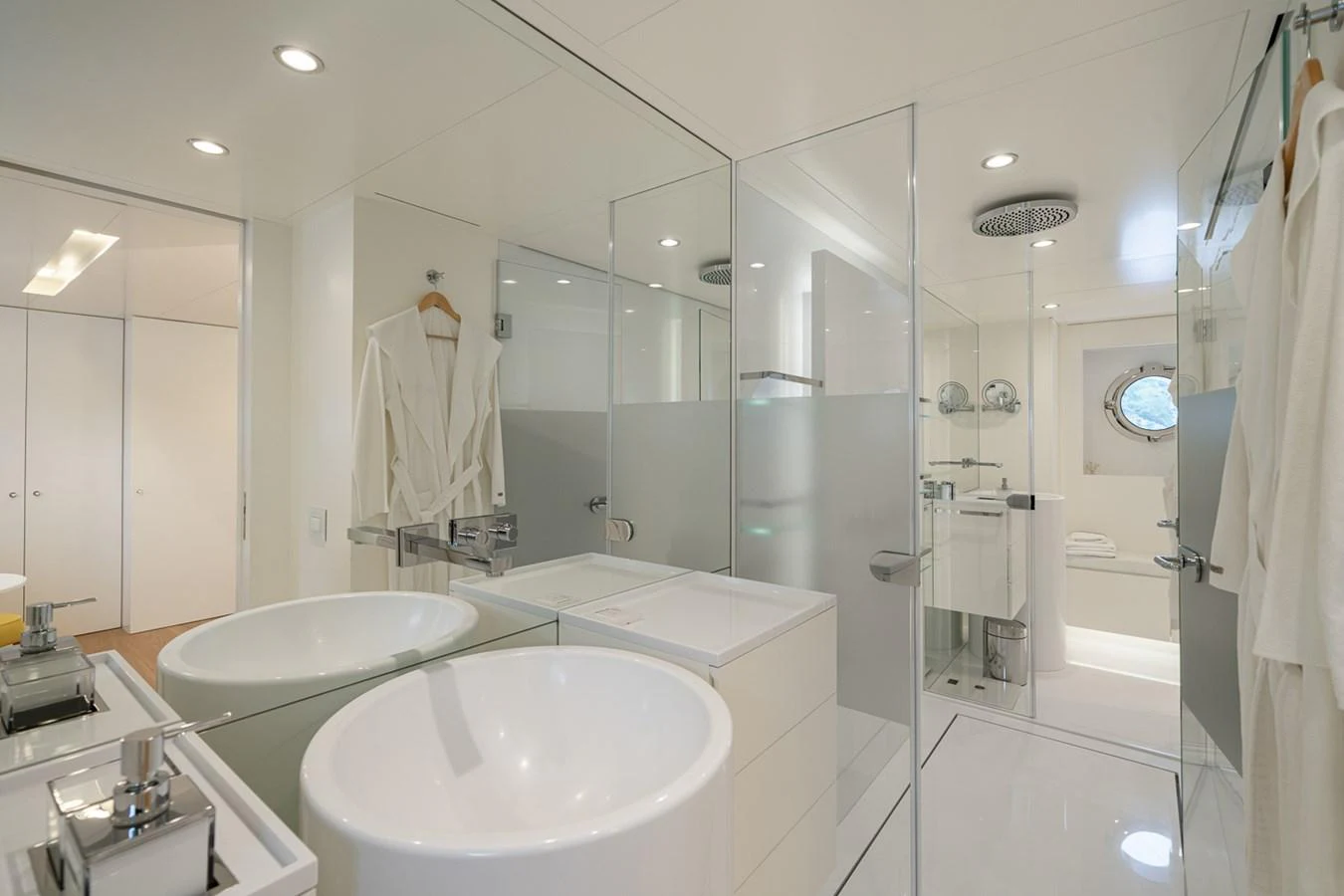 a bathroom with a large glass shower aboard ESOSH Yacht for Sale