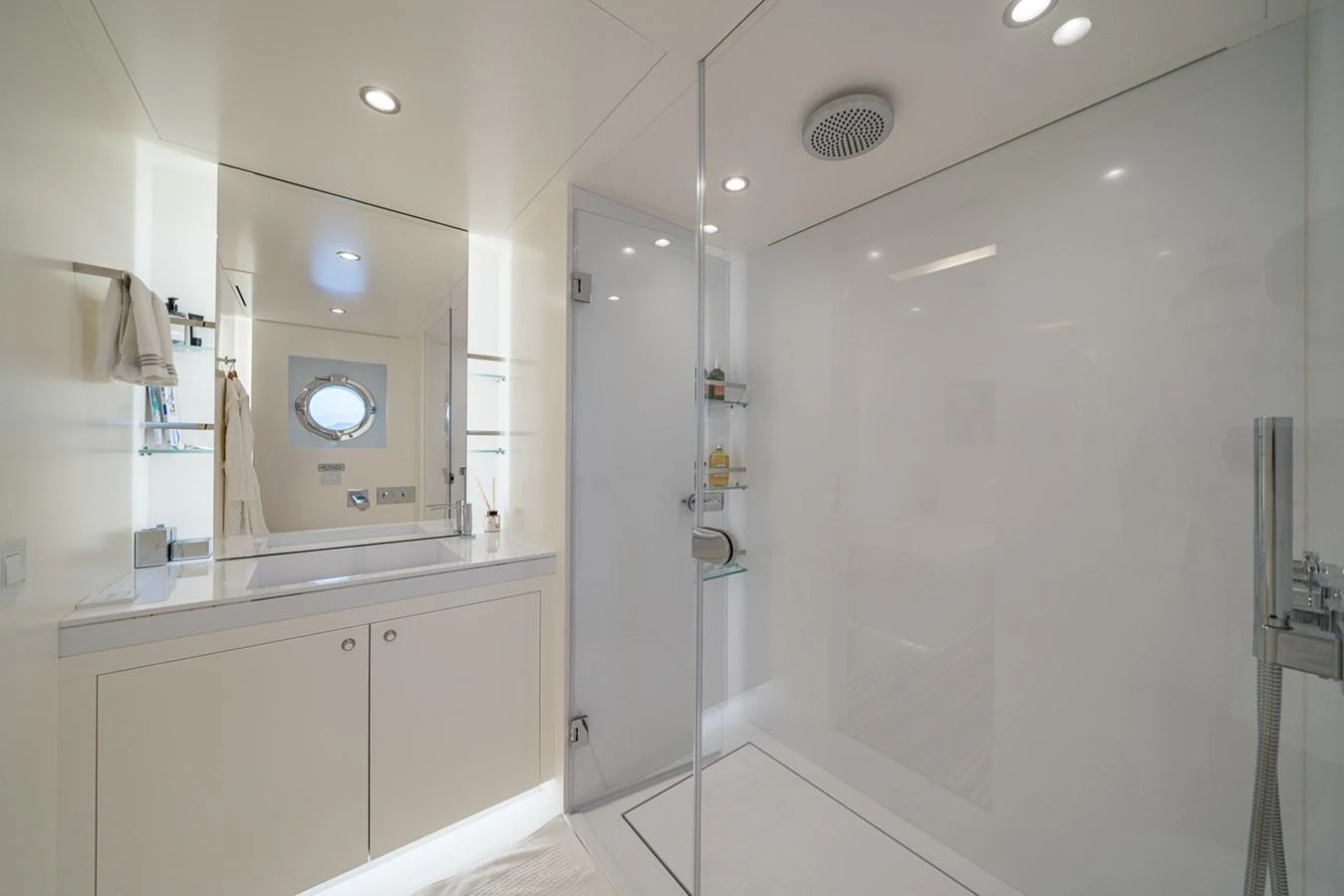 a bathroom with a shower unit and sink aboard ESOSH Yacht for Sale