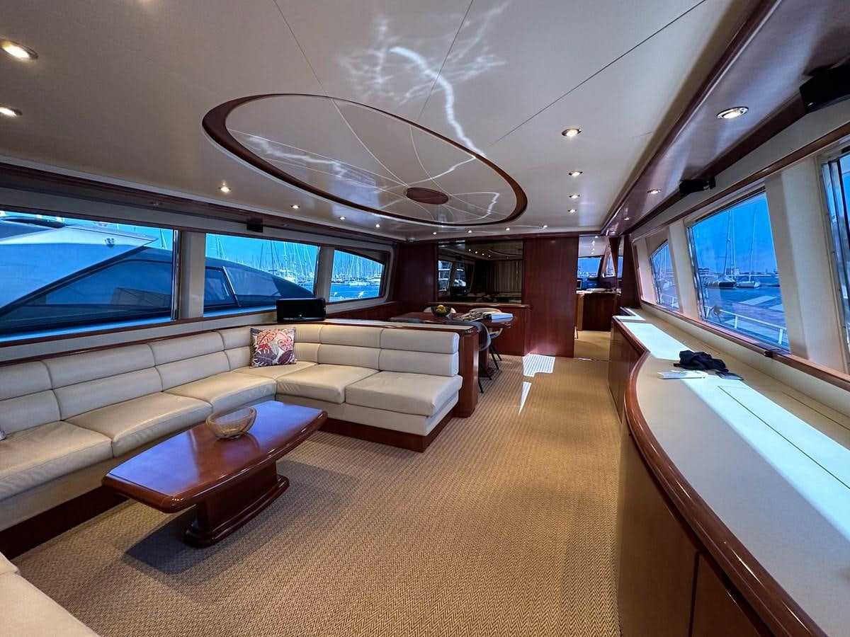a living room with a large window aboard VIDA LOCA Yacht for Sale