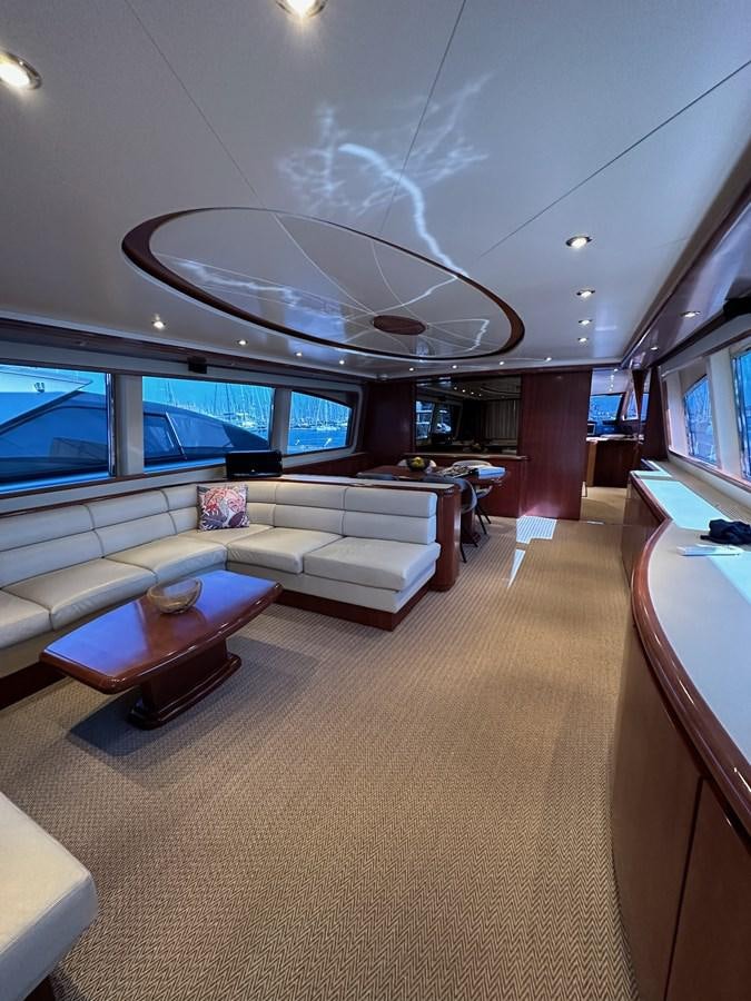 a living room with a large ceiling aboard VIDA LOCA Yacht for Sale