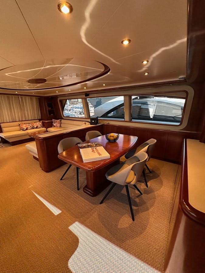 a dining room with a table and chairs aboard VIDA LOCA Yacht for Sale