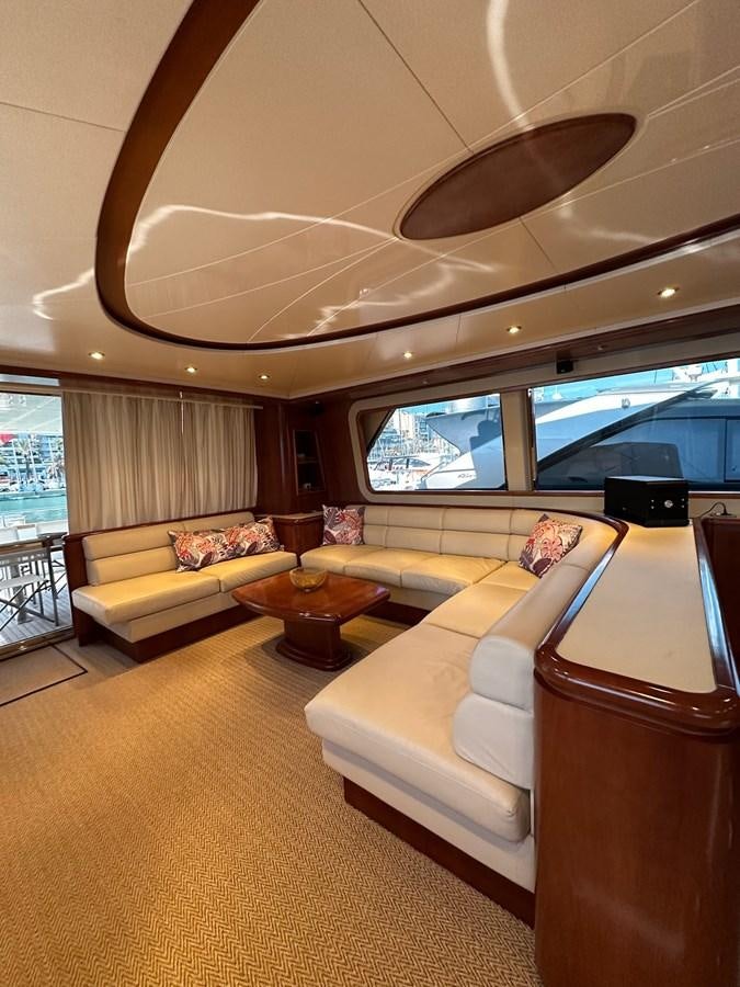 a living room with a ceiling fan aboard VIDA LOCA Yacht for Sale