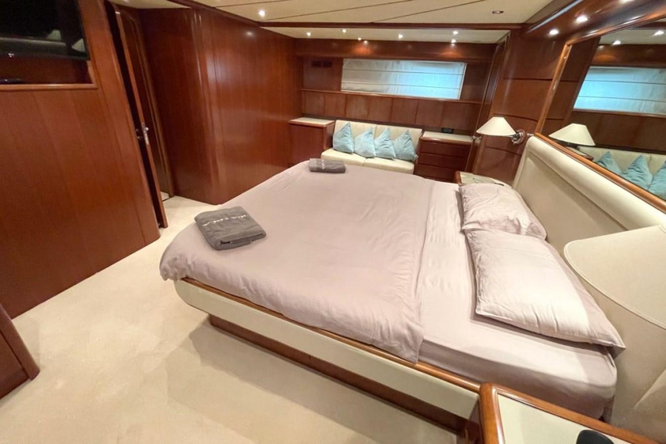 a bed in a room aboard VIDA LOCA Yacht for Sale