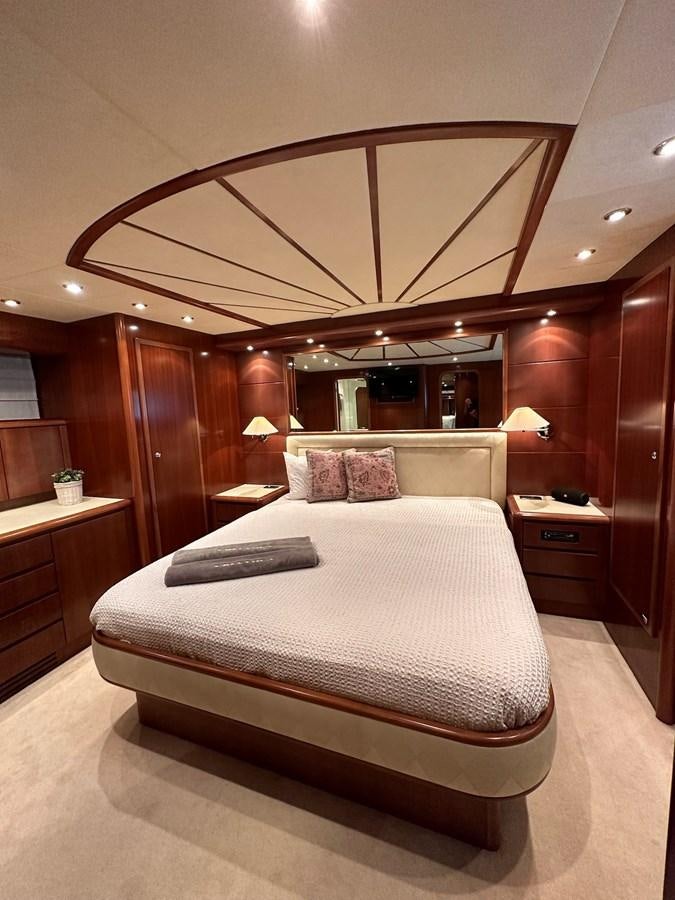 a bed in a room aboard VIDA LOCA Yacht for Sale