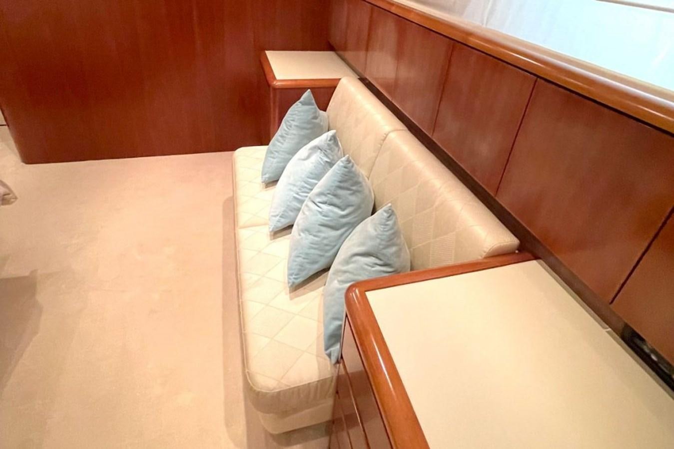a person lying on a couch aboard VIDA LOCA Yacht for Sale