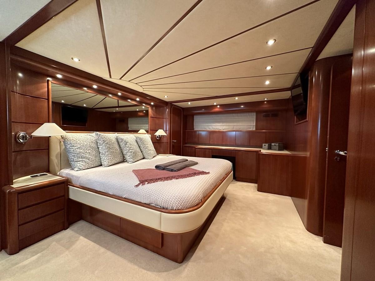 a bed in a room aboard VIDA LOCA Yacht for Sale