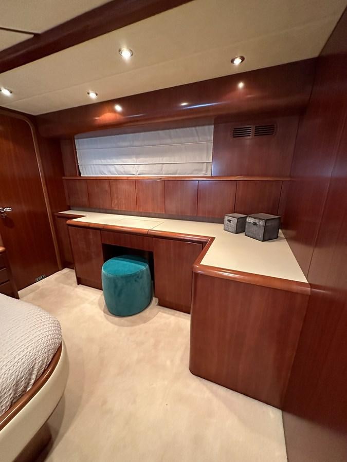 a room with a blue bucket and a white bed aboard VIDA LOCA Yacht for Sale