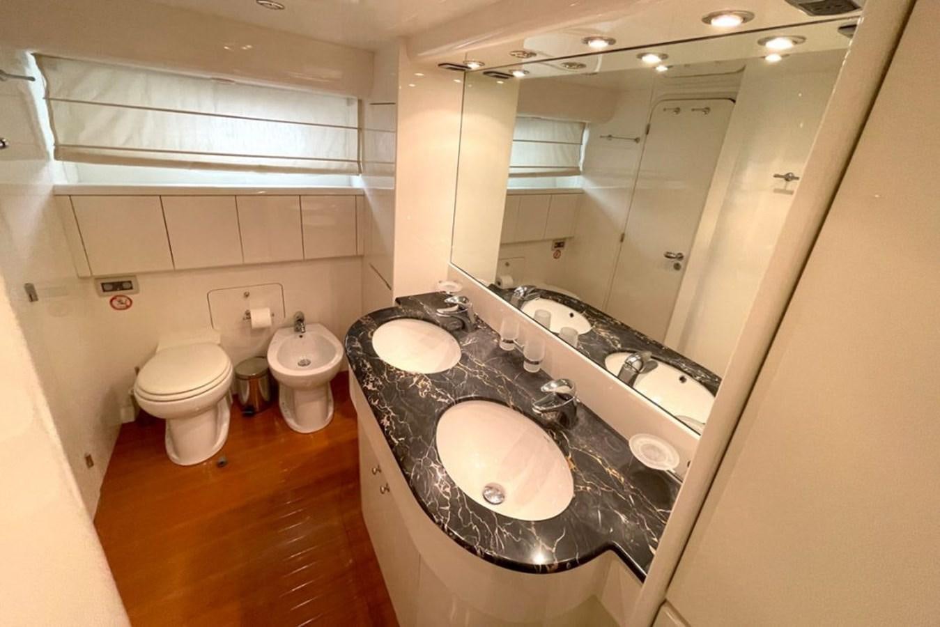 a bathroom with a large mirror aboard VIDA LOCA Yacht for Sale