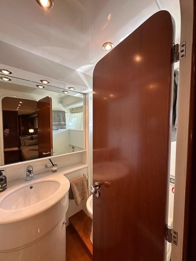 a bathroom with a sink and a mirror aboard VIDA LOCA Yacht for Sale