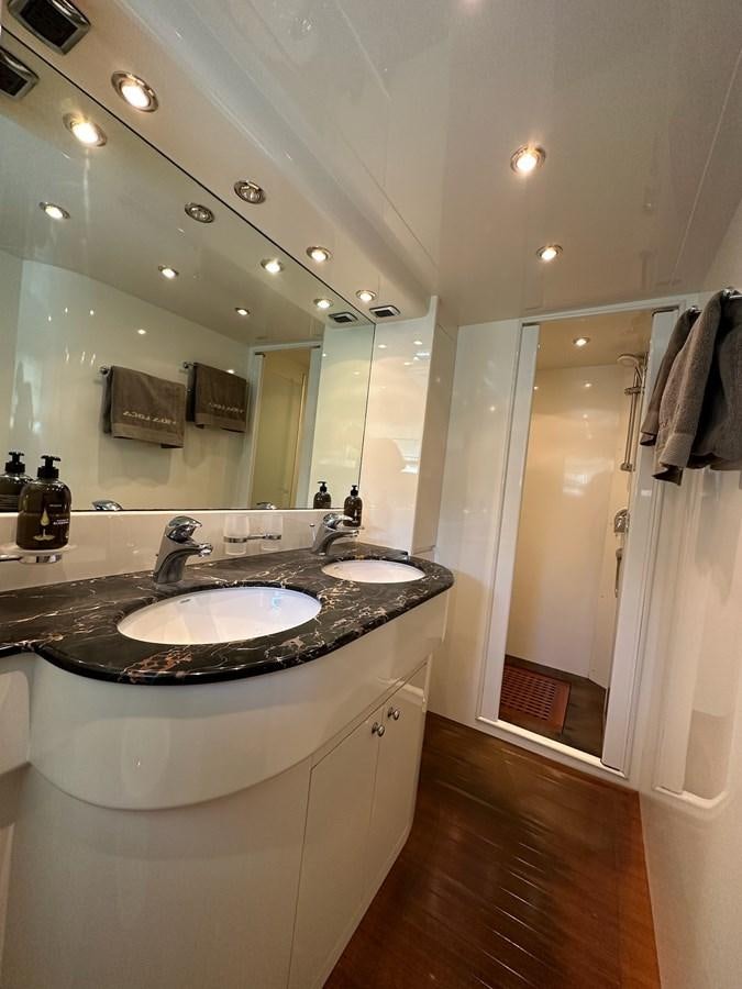 a bathroom with a large mirror aboard VIDA LOCA Yacht for Sale