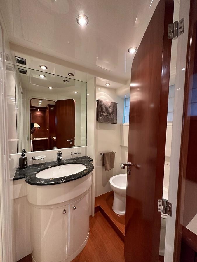 a bathroom with a sink and a mirror aboard VIDA LOCA Yacht for Sale