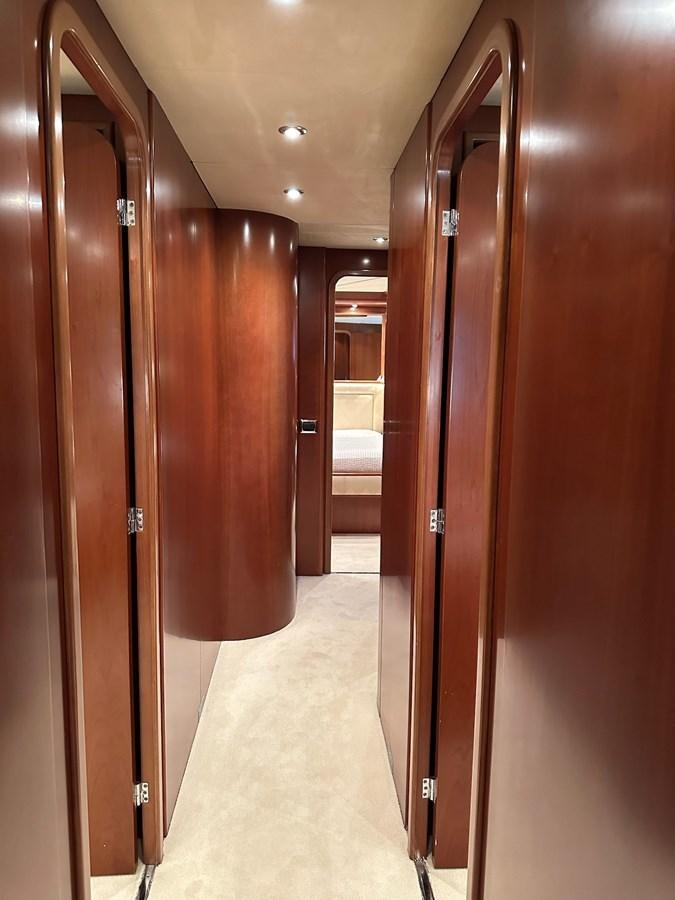 a hallway with several doors aboard VIDA LOCA Yacht for Sale