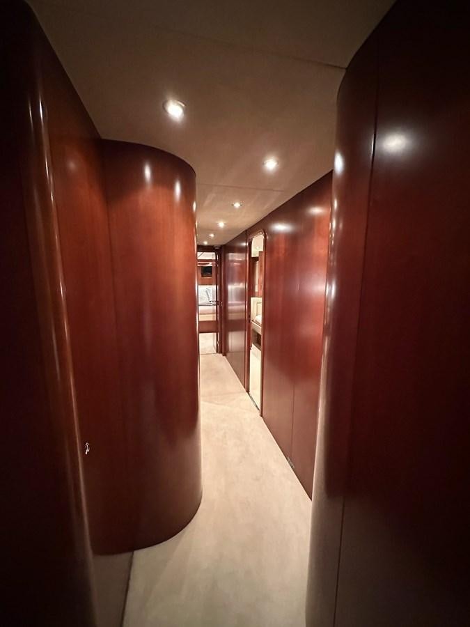 a hallway with a few doors aboard VIDA LOCA Yacht for Sale