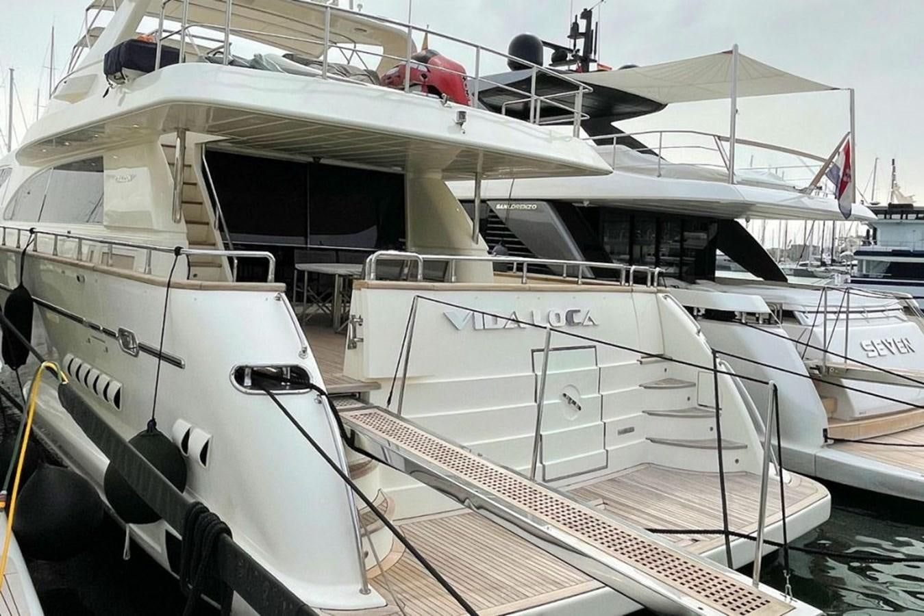 a boat docked at a pier aboard VIDA LOCA Yacht for Sale