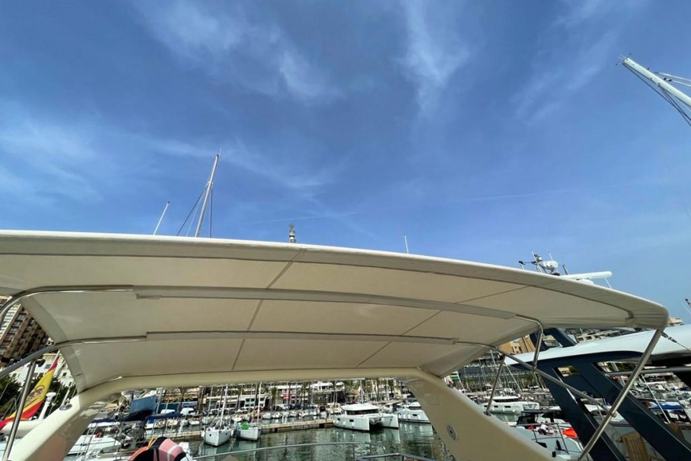 a view of a large white building with a lot of windows and a blue sky aboard VIDA LOCA Yacht for Sale