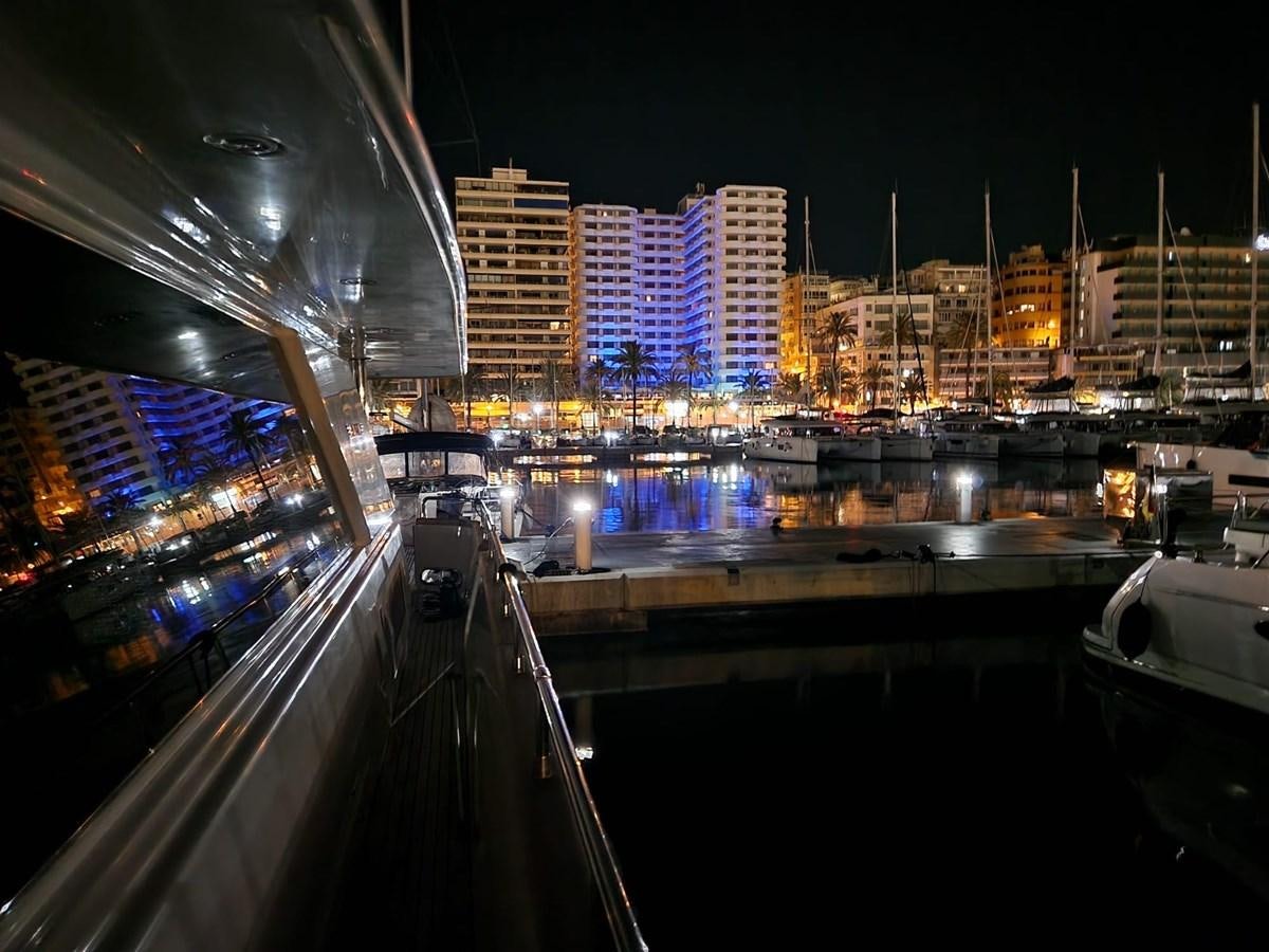 a city with lights on aboard VIDA LOCA Yacht for Sale