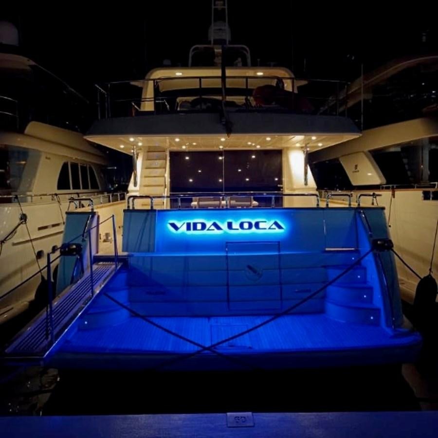 a boat with a sign on the side aboard VIDA LOCA Yacht for Sale