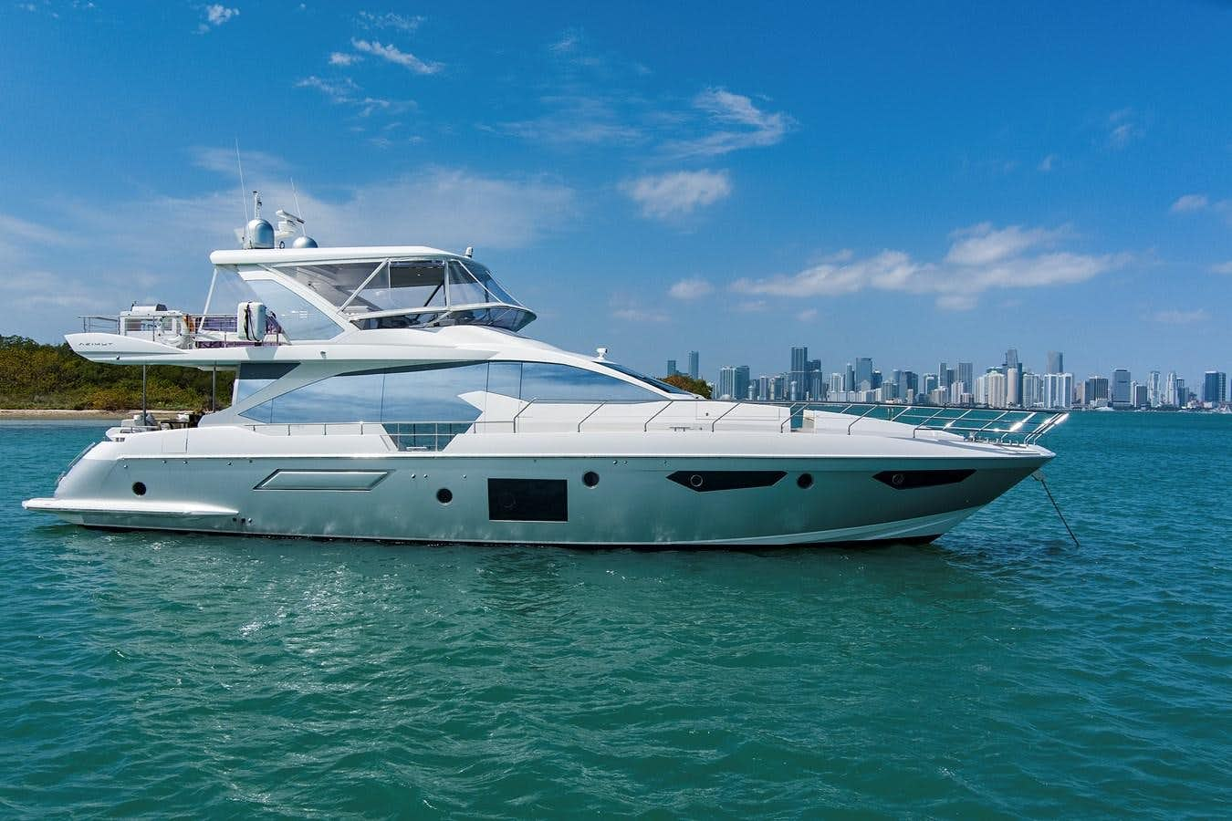 a white yacht in the water aboard GRATITUDE Yacht for Sale