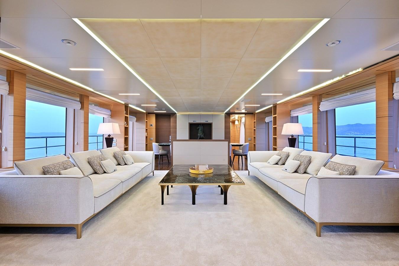 a living room with a couch and a coffee table aboard FREEDAY Yacht for Sale