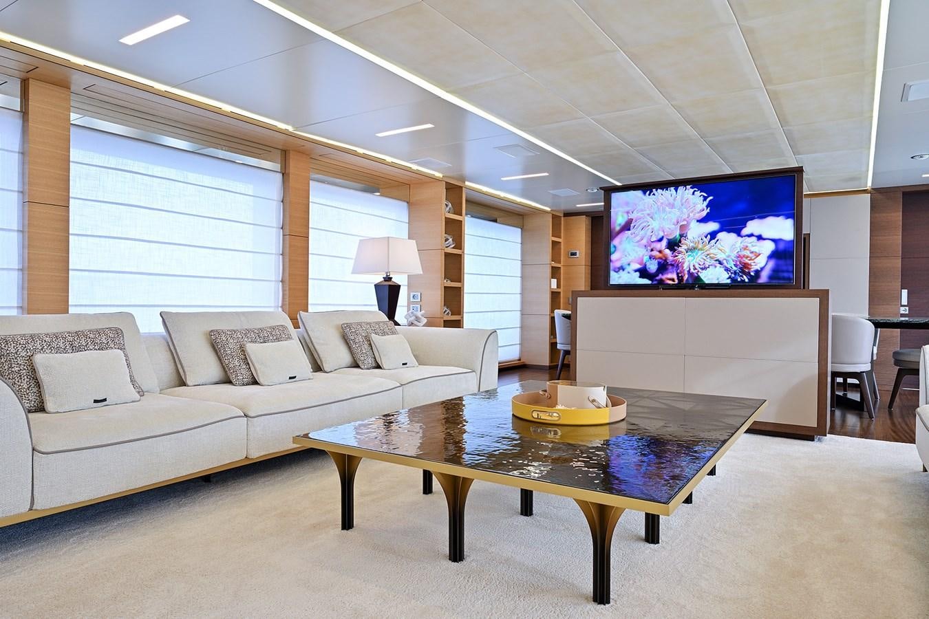 a living room with a large screen aboard FREEDAY Yacht for Sale