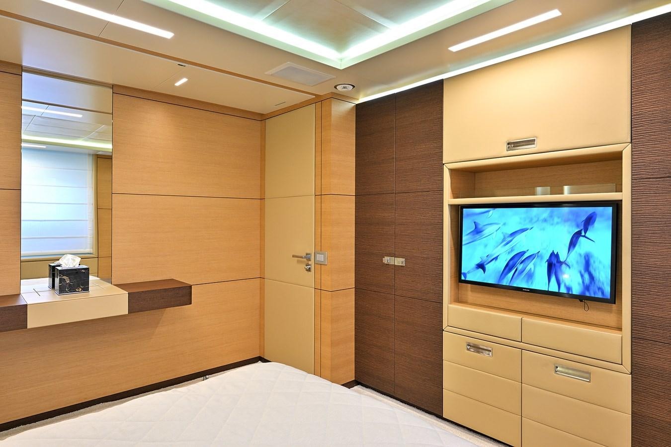 a room with a tv and a bed aboard FREEDAY Yacht for Sale
