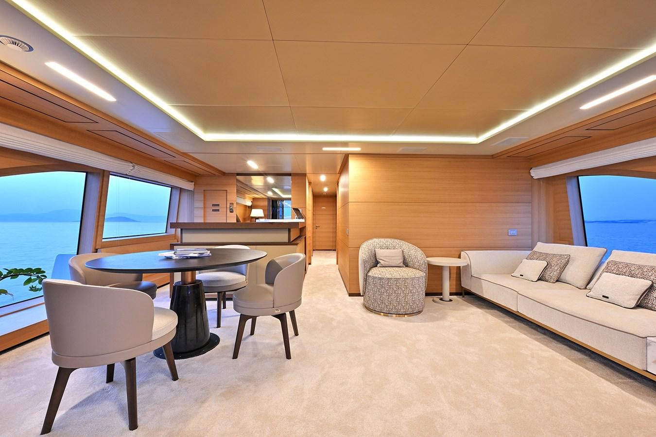 a living room with a couch and a table aboard FREEDAY Yacht for Sale