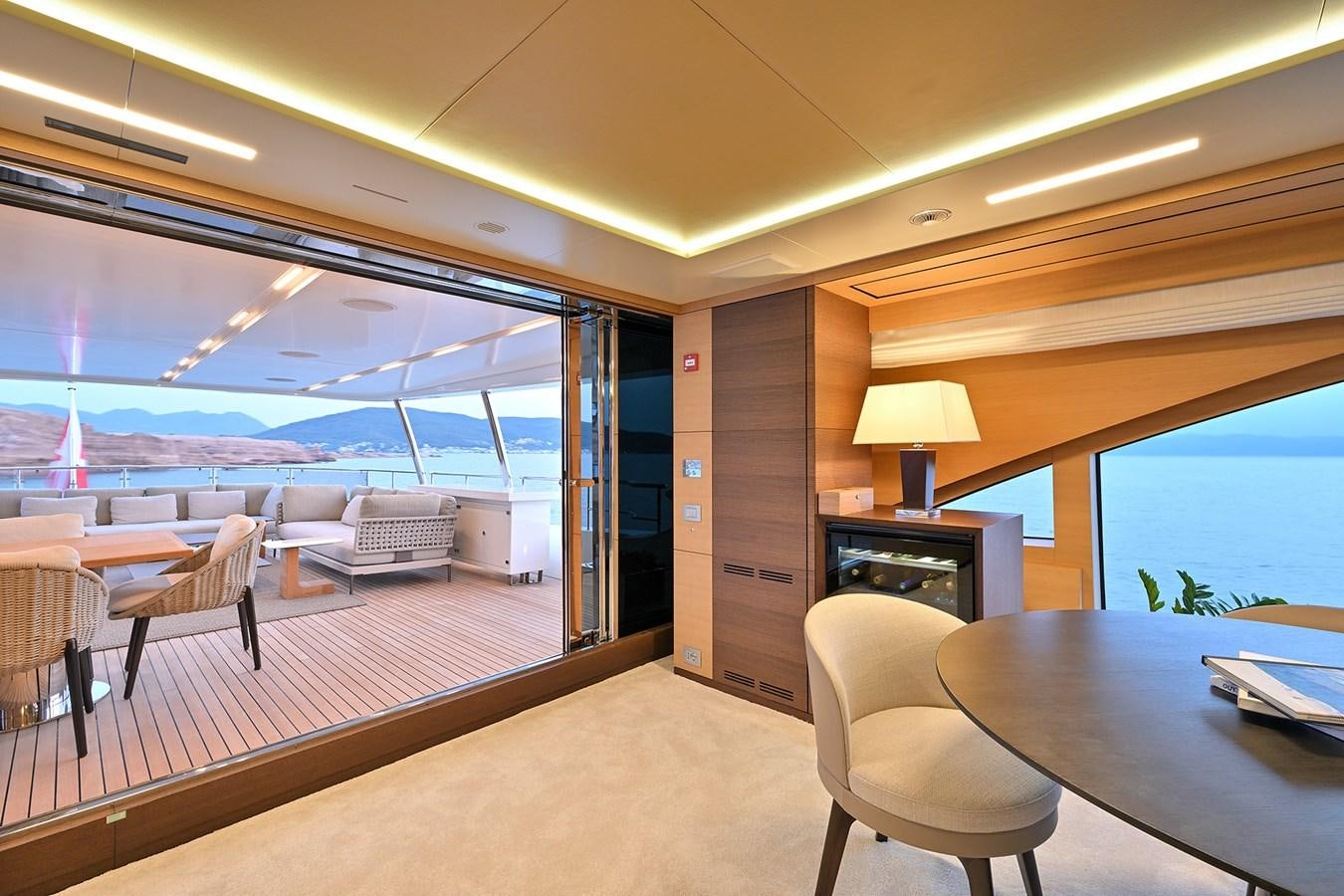 a room with a table and chairs aboard FREEDAY Yacht for Sale