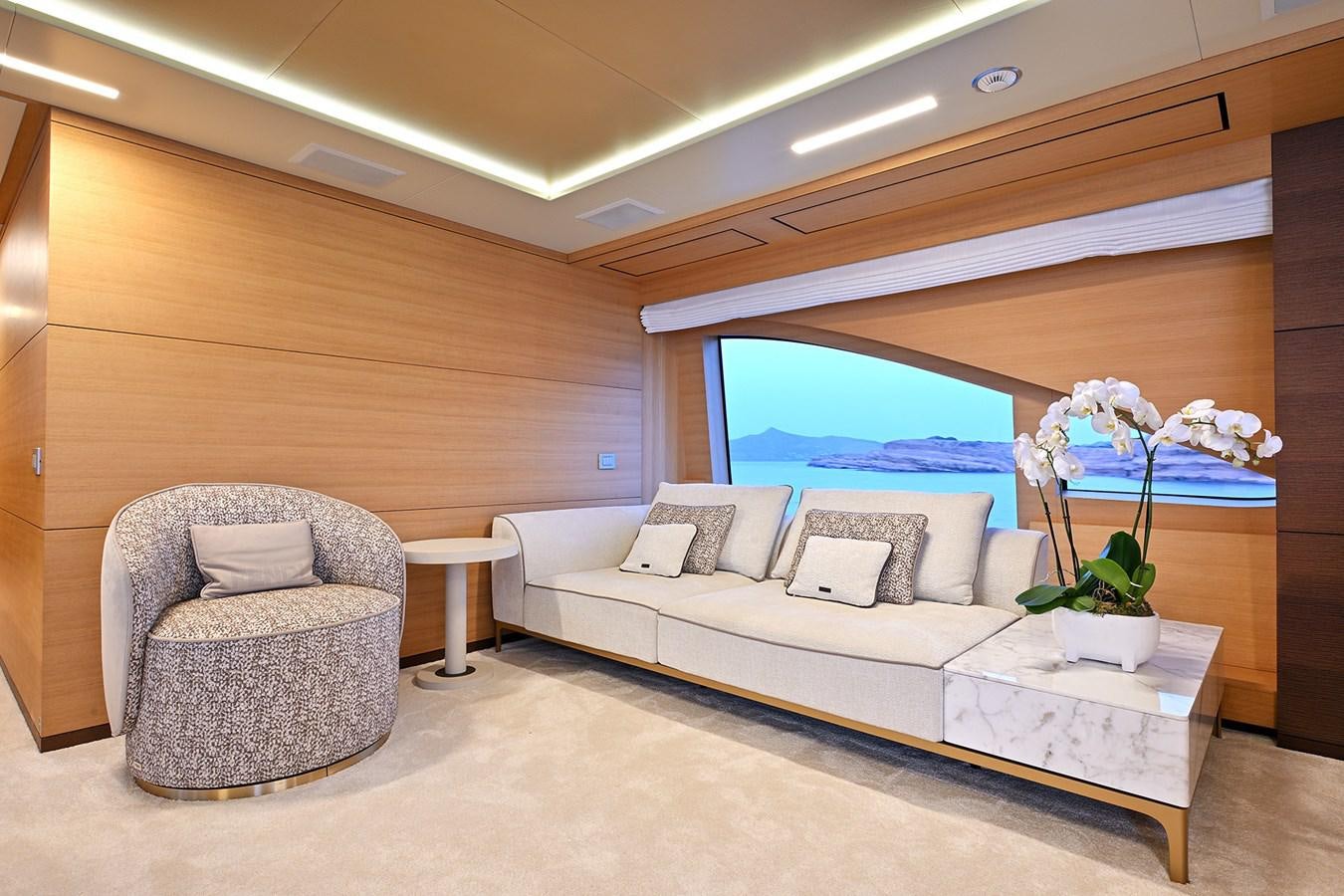 a room with a couch and a table and a window aboard FREEDAY Yacht for Sale