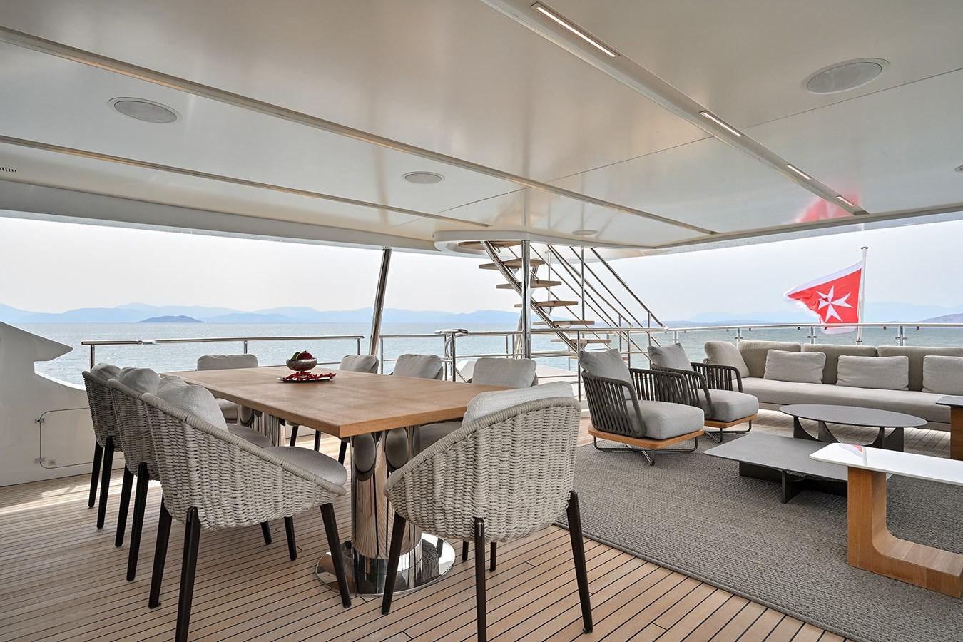 a room with a table and chairs aboard FREEDAY Yacht for Sale