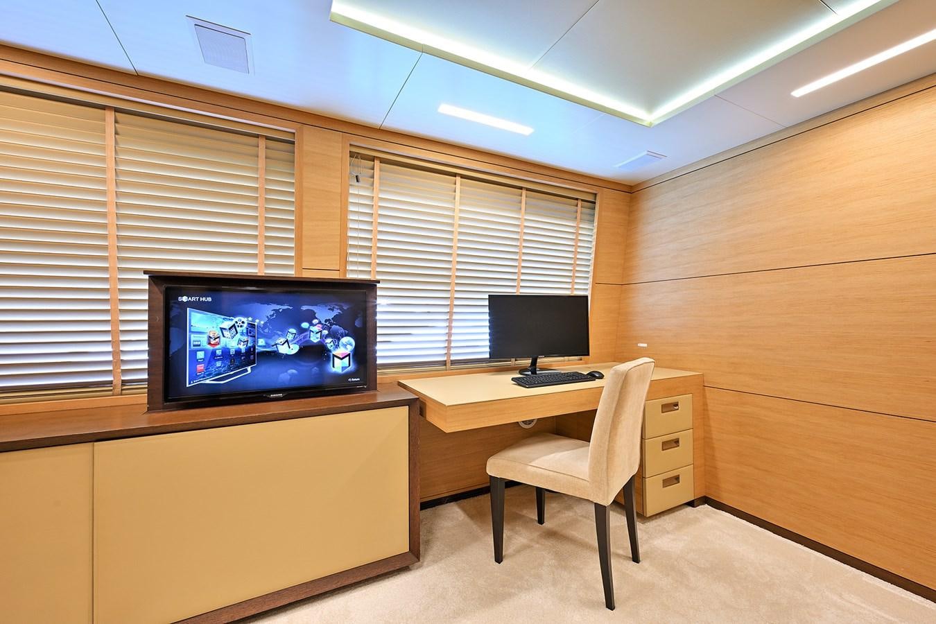 a room with a tv and a chair aboard FREEDAY Yacht for Sale