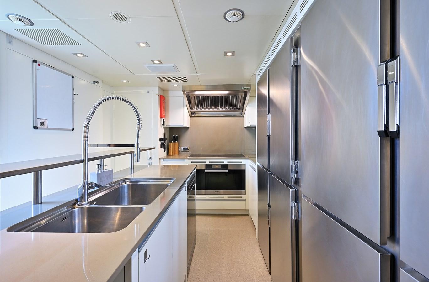 a kitchen with stainless steel appliances aboard FREEDAY Yacht for Sale