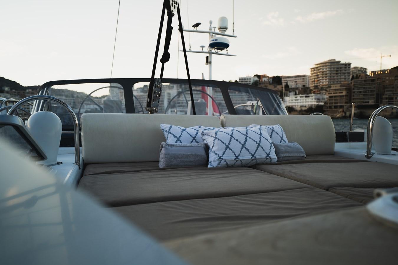 a white car with a white pillow on the front seat aboard YQUEM Yacht for Sale