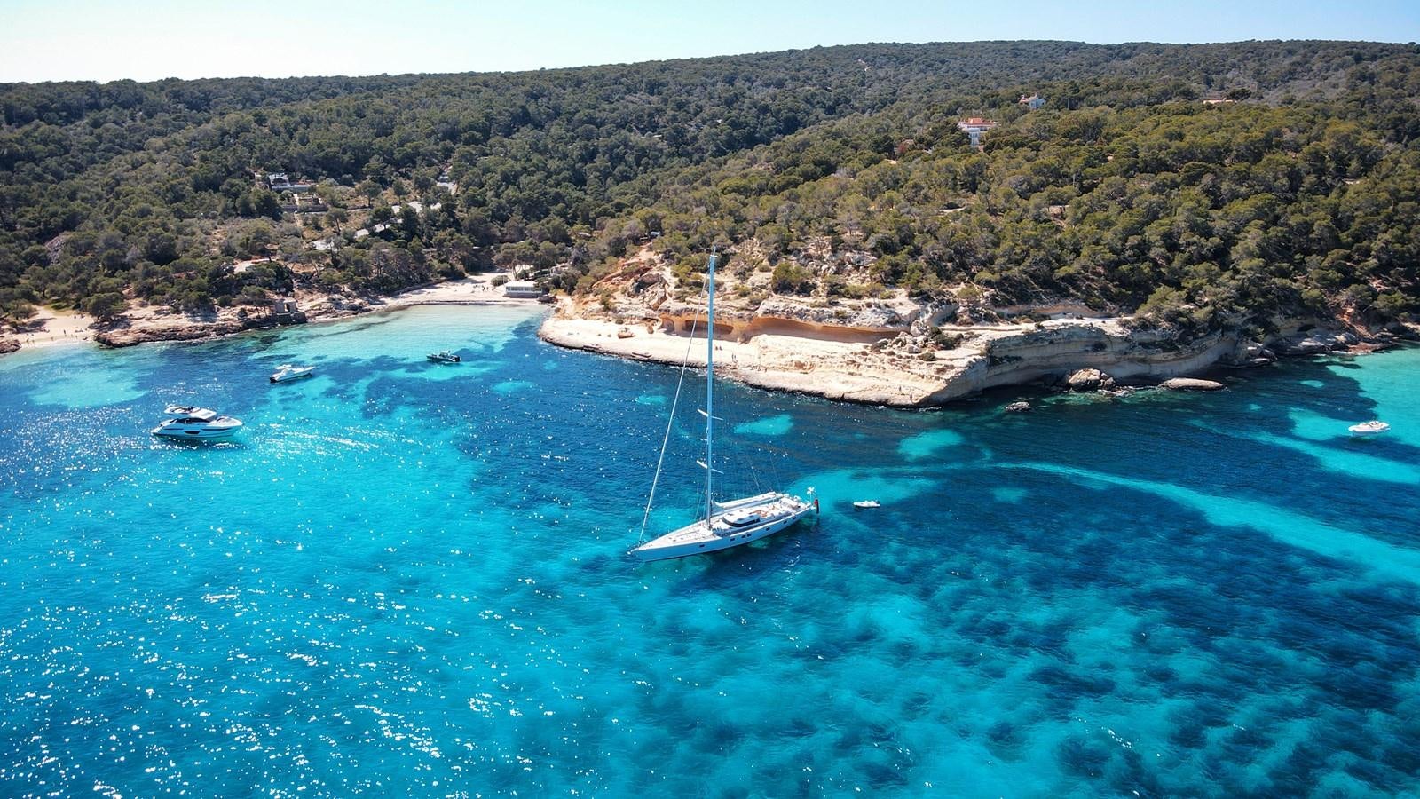 a sailboat in the water aboard YQUEM Yacht for Sale